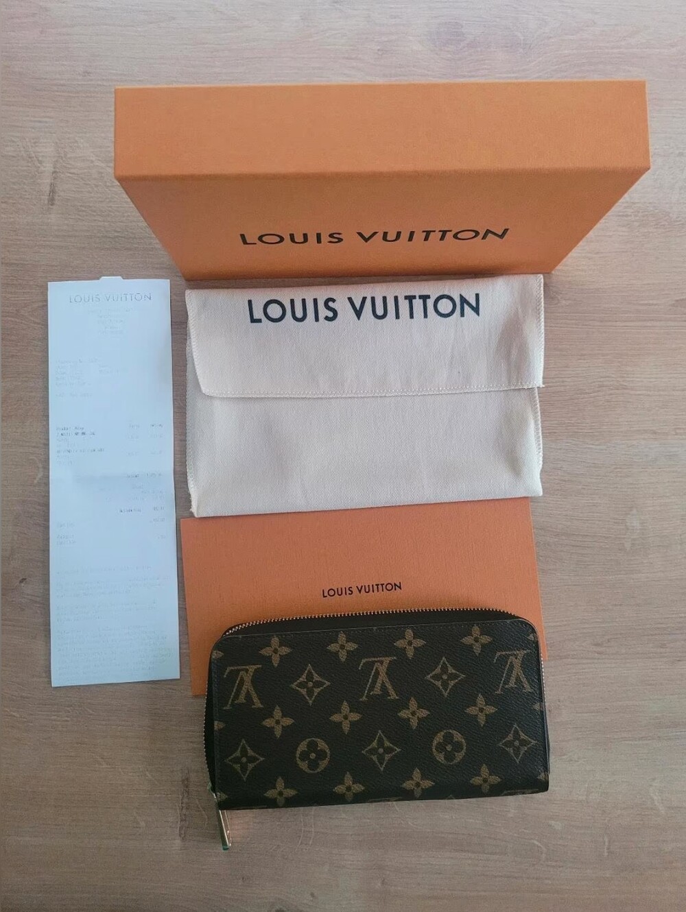 Louis Vuitton Brown Leather Zip-Around Wallet with Gold Hardware